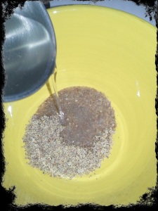 Pour warm water into bowl with flax mixture